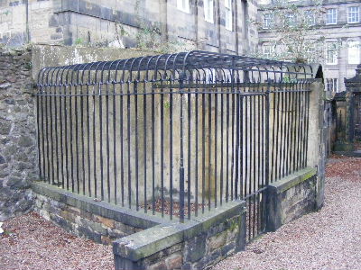 Grave protected by metal grilles